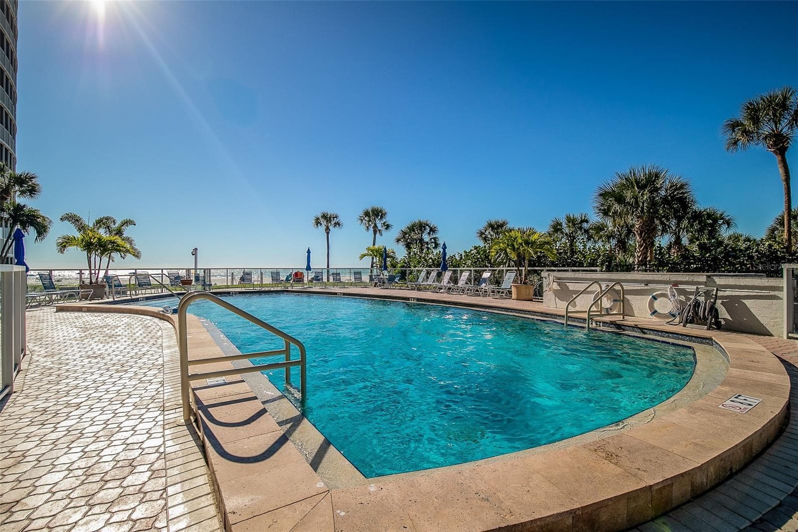 The community heated pool overlooks the beach and Gulf. - 6300 MIDNIGHT PASS RD #21, SARASOTA