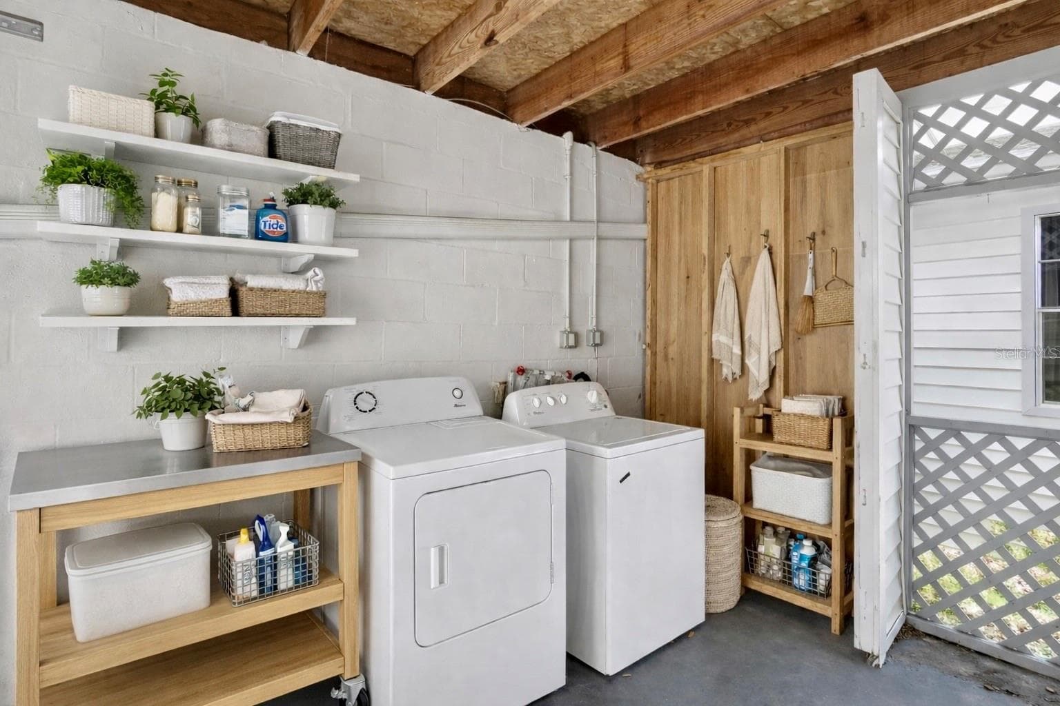 VIRTUAL STAGED GARAGE LAUNDRY AREA - 11920 DIETZ DR #11920, TAMPA