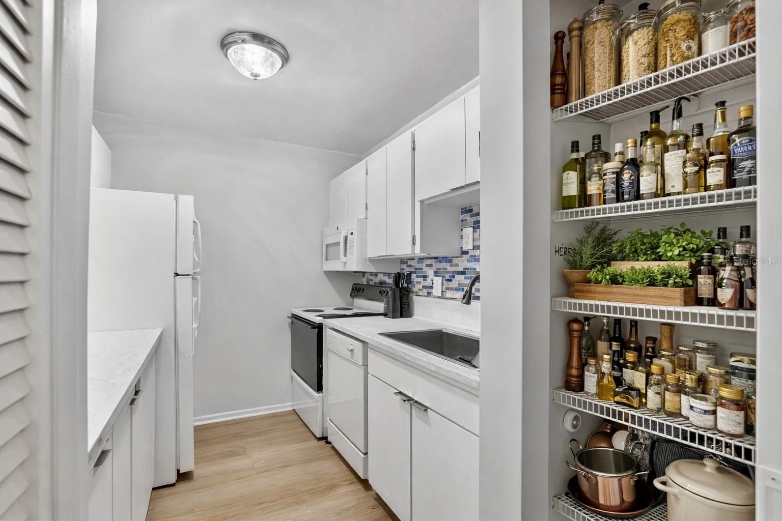 VIRTUAL STAGED PANTRY - 11920 DIETZ DR #11920, TAMPA