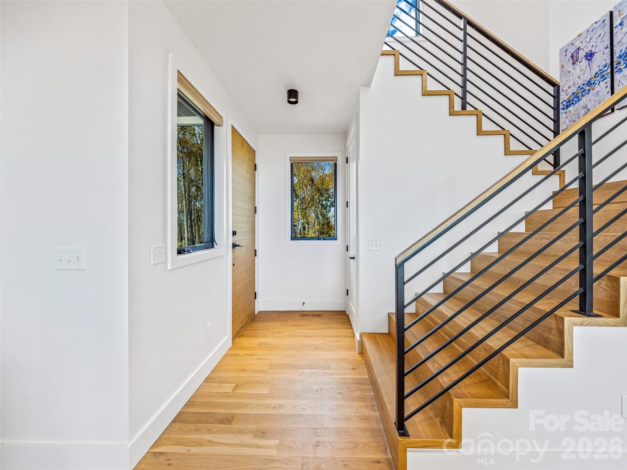 Access the main level, upstairs, or downstairs terrace level from the foyer. - Fletcher