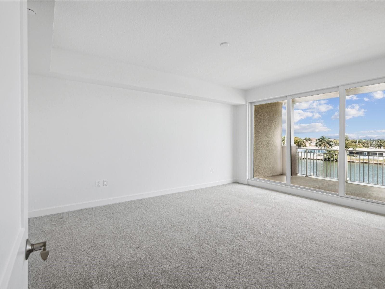 Primary bedroom Sliding door to balcony - 125 ISLAND WAY #304, CLEARWATER BEACH