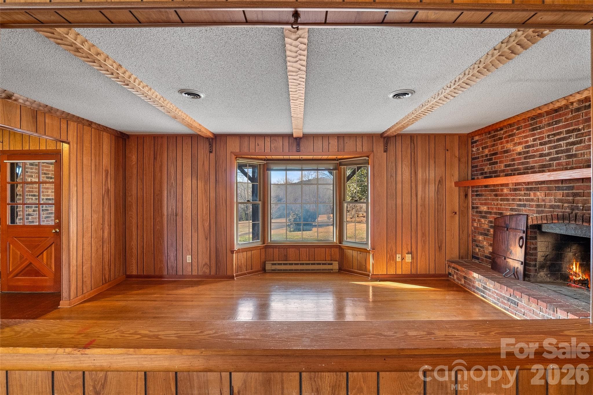 Passthrough window from kitchen to living room.  Entry door from front porch to left. - 591 Landrum Road, Columbus