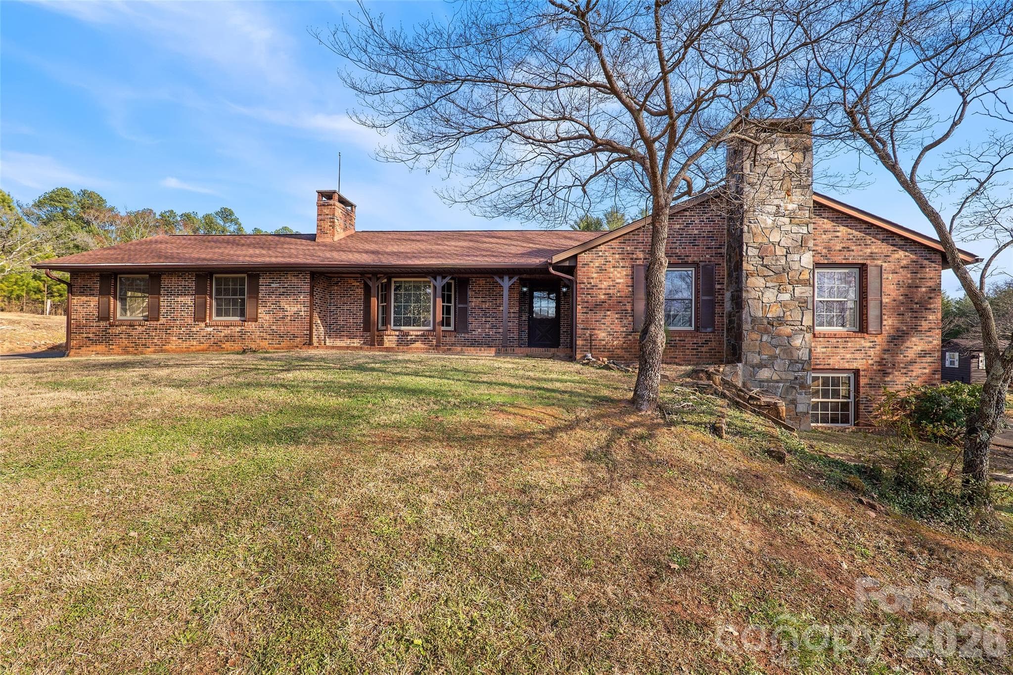 Front view of all brick home with impressive rock fireplace - 591 Landrum Road, Columbus