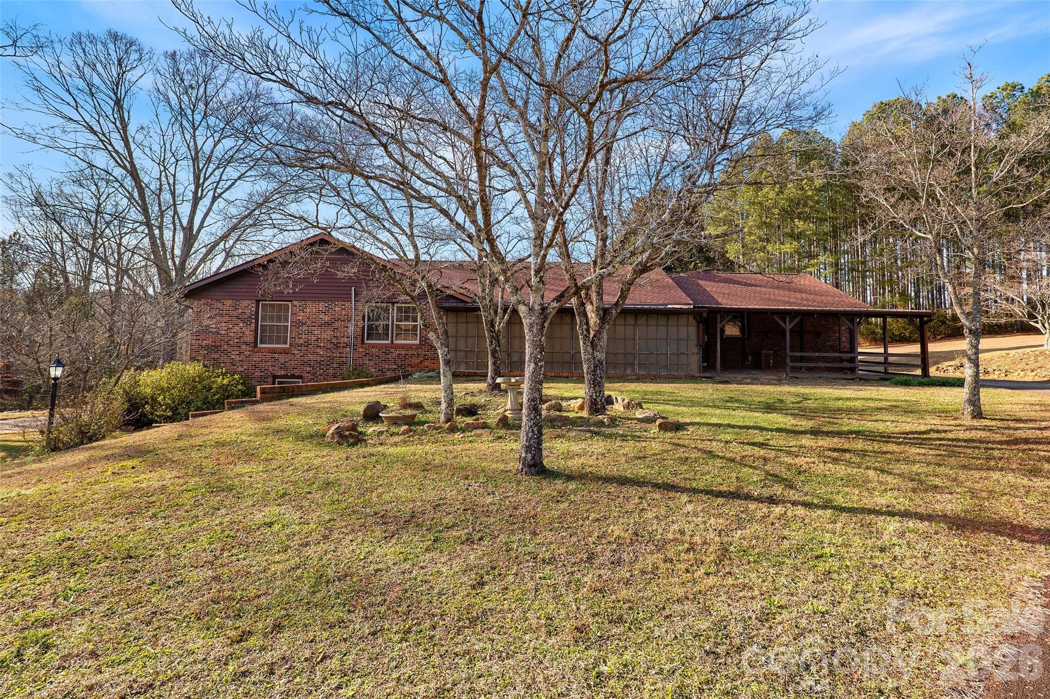 Rear view showing expansive screen porch and covered patio - 591 Landrum Road, Columbus