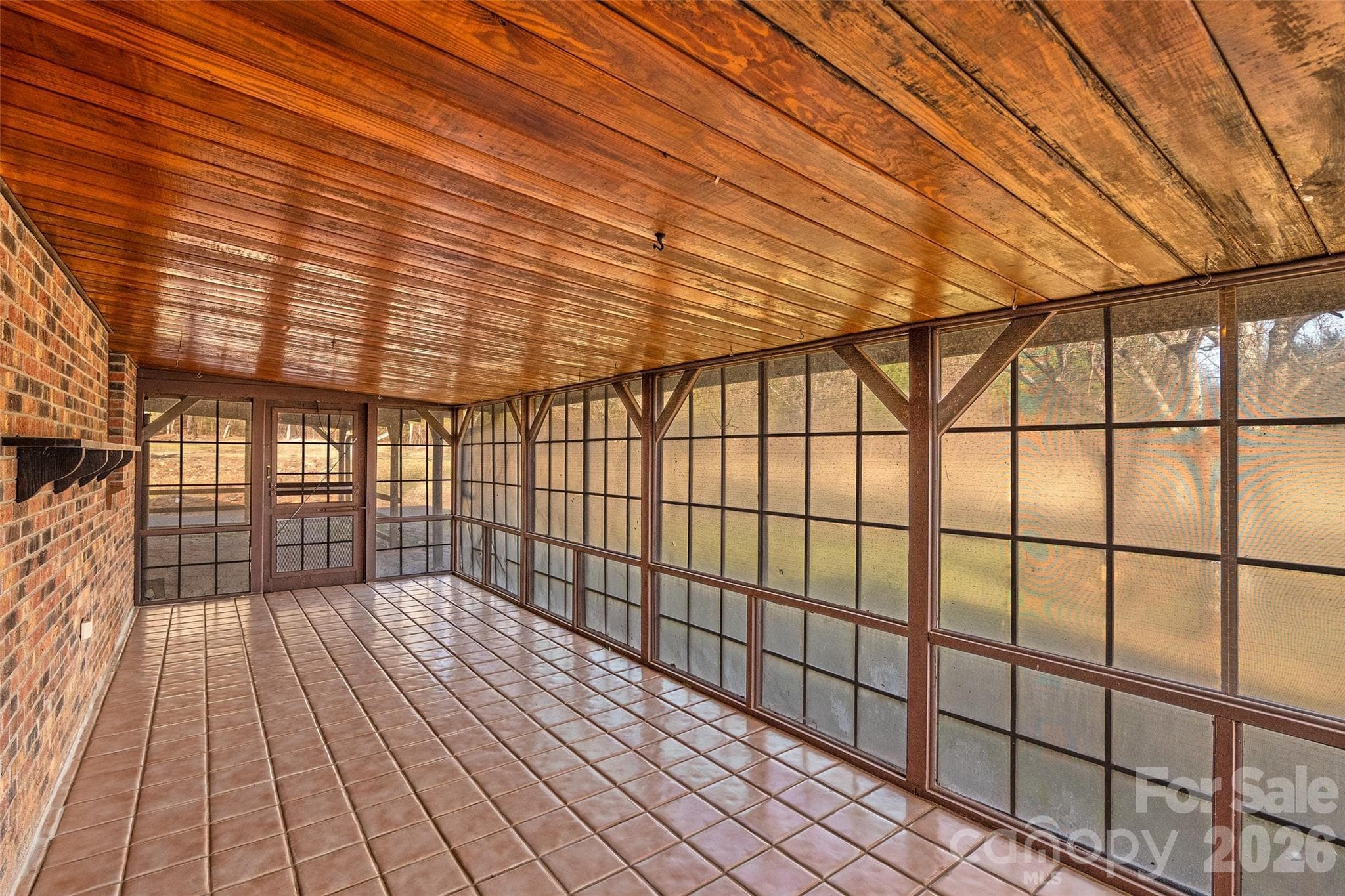 Rear screened porch facing entry to covered patio. - 591 Landrum Road, Columbus