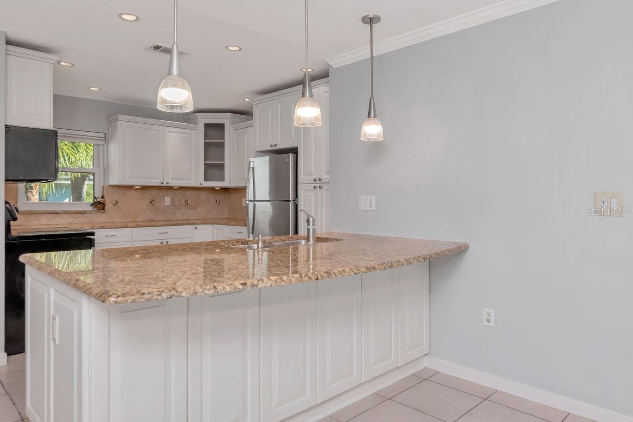 Great under-counter storage capacity in updated kitchen - 2650 COUNTRYSIDE BLVD #F303, CLEARWATER