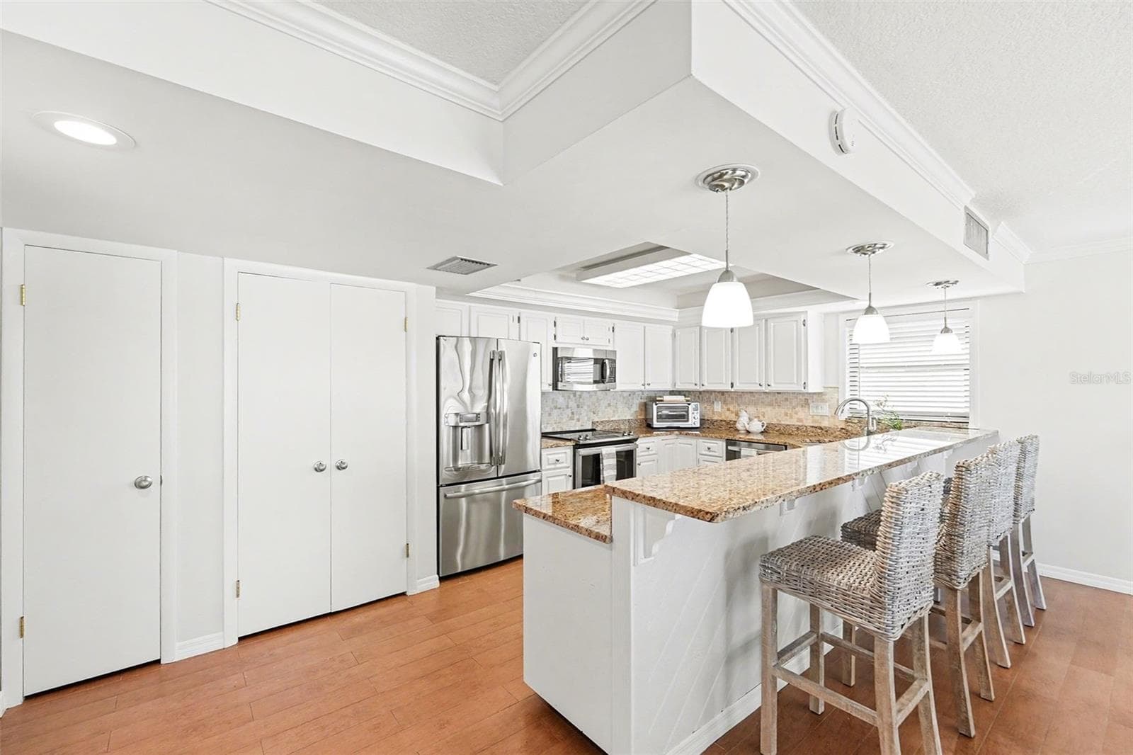 Plenty of storage with large pantry utility closet, and ample kitchen cabinets. - 19936 GULF BLVD, INDIAN SHORES