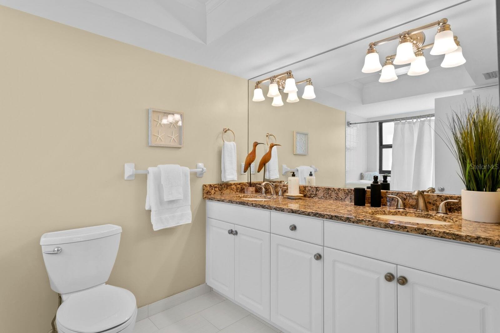Ensuite bathroom with dual sink vanity - 19936 GULF BLVD, INDIAN SHORES