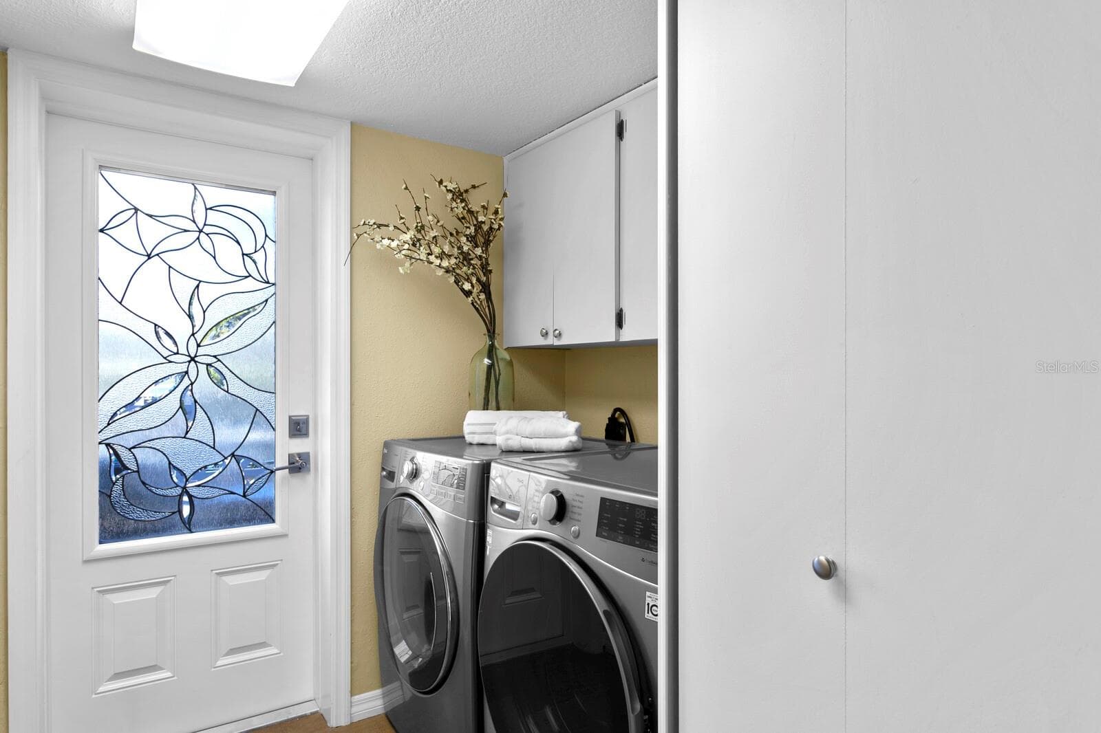 Second level laundry room. Door leads to east facing balcony with partial Intracoastal views. - 19936 GULF BLVD, INDIAN SHORES