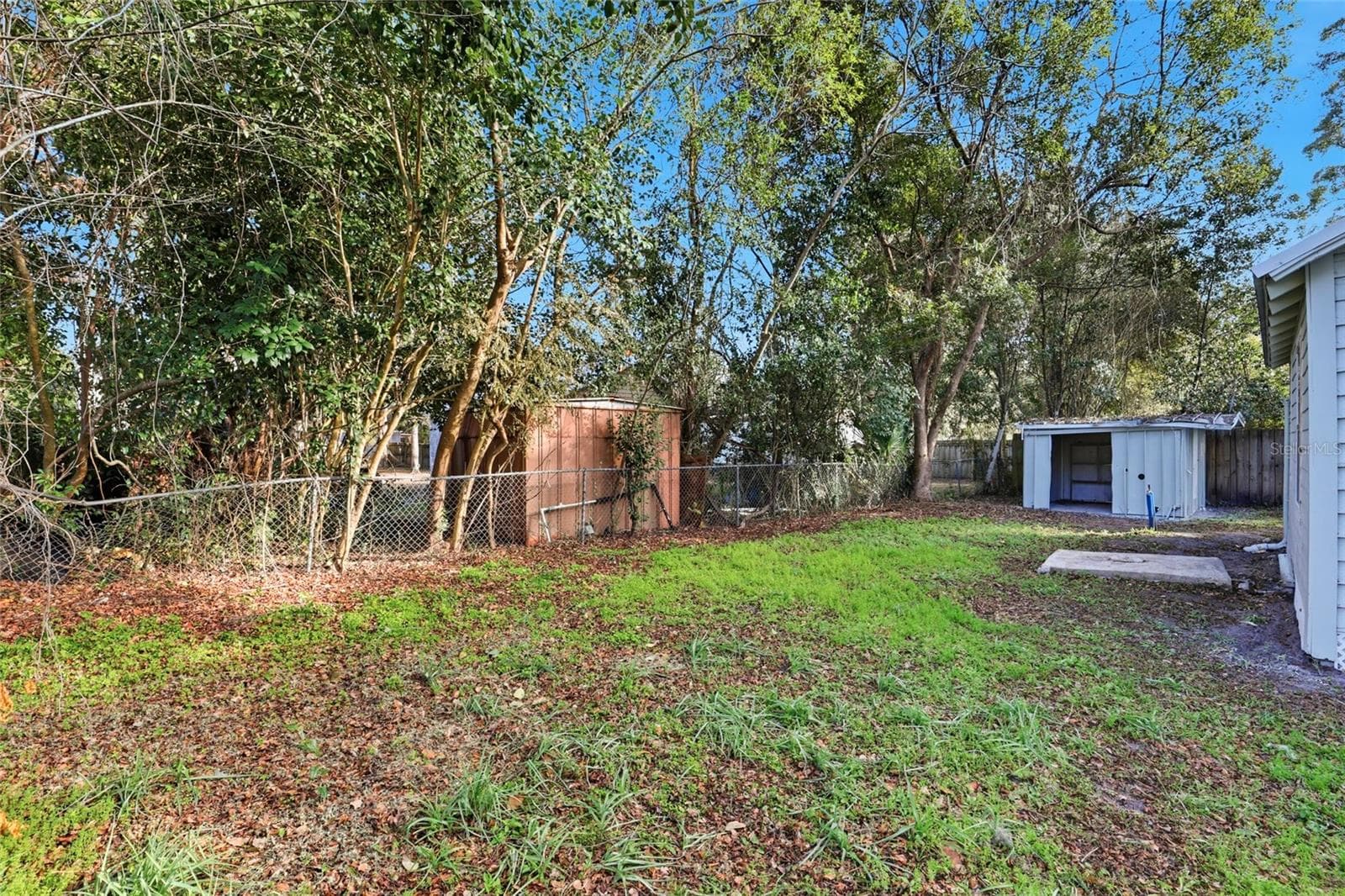 Backyard with storage shed - USDA eligible, $0 down financing available - 425 SE 2ND ST, WILLISTON