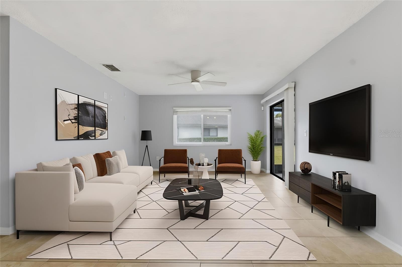Living room virtually staged - 2701 COUNTRYSIDE BLVD #102, CLEARWATER