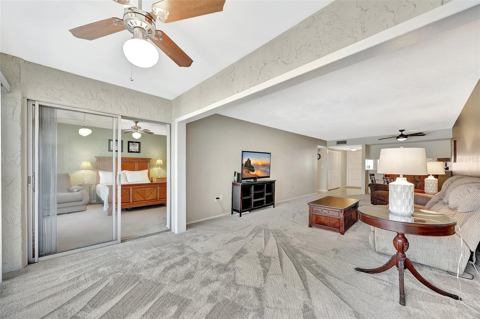 The main bedroom has slider to sunroom area - 113 ISLAND WAY #241, CLEARWATER BEACH
