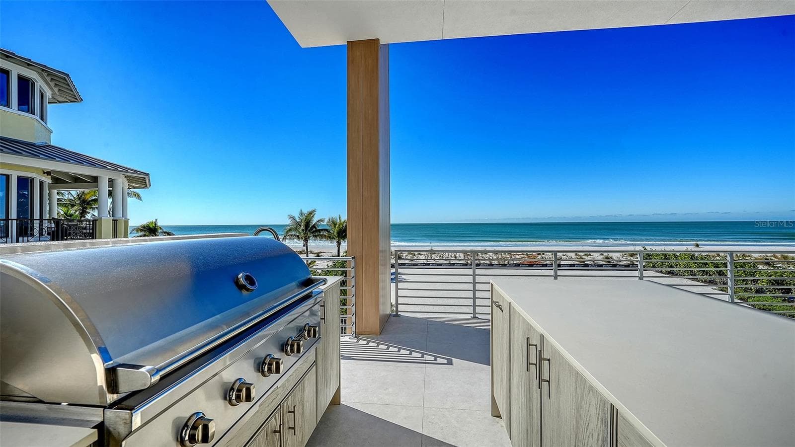 Summer kitchen with Coyote™ gas grill, refridgerator and sink. - 6489 GULFSIDE RD, LONGBOAT KEY