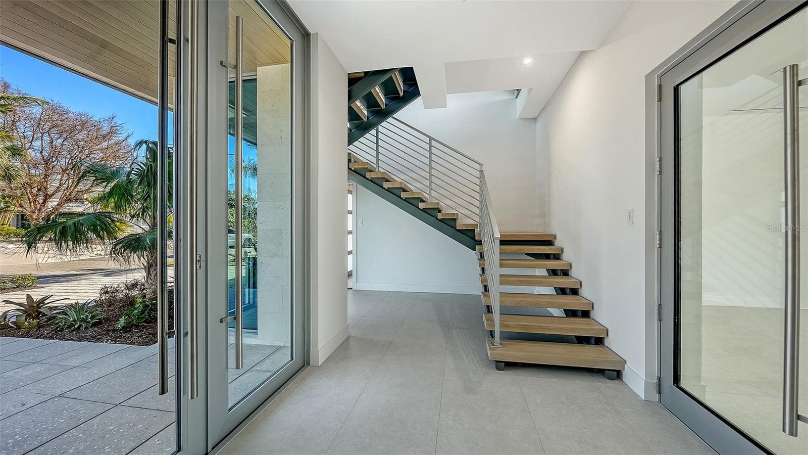 Floating steel staircase with handmade white oak treads - 6489 GULFSIDE RD, LONGBOAT KEY