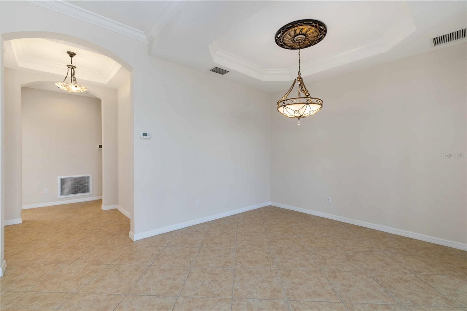 Dining room and a foyer - 1264 RIVERSCAPE ST #B, BRADENTON