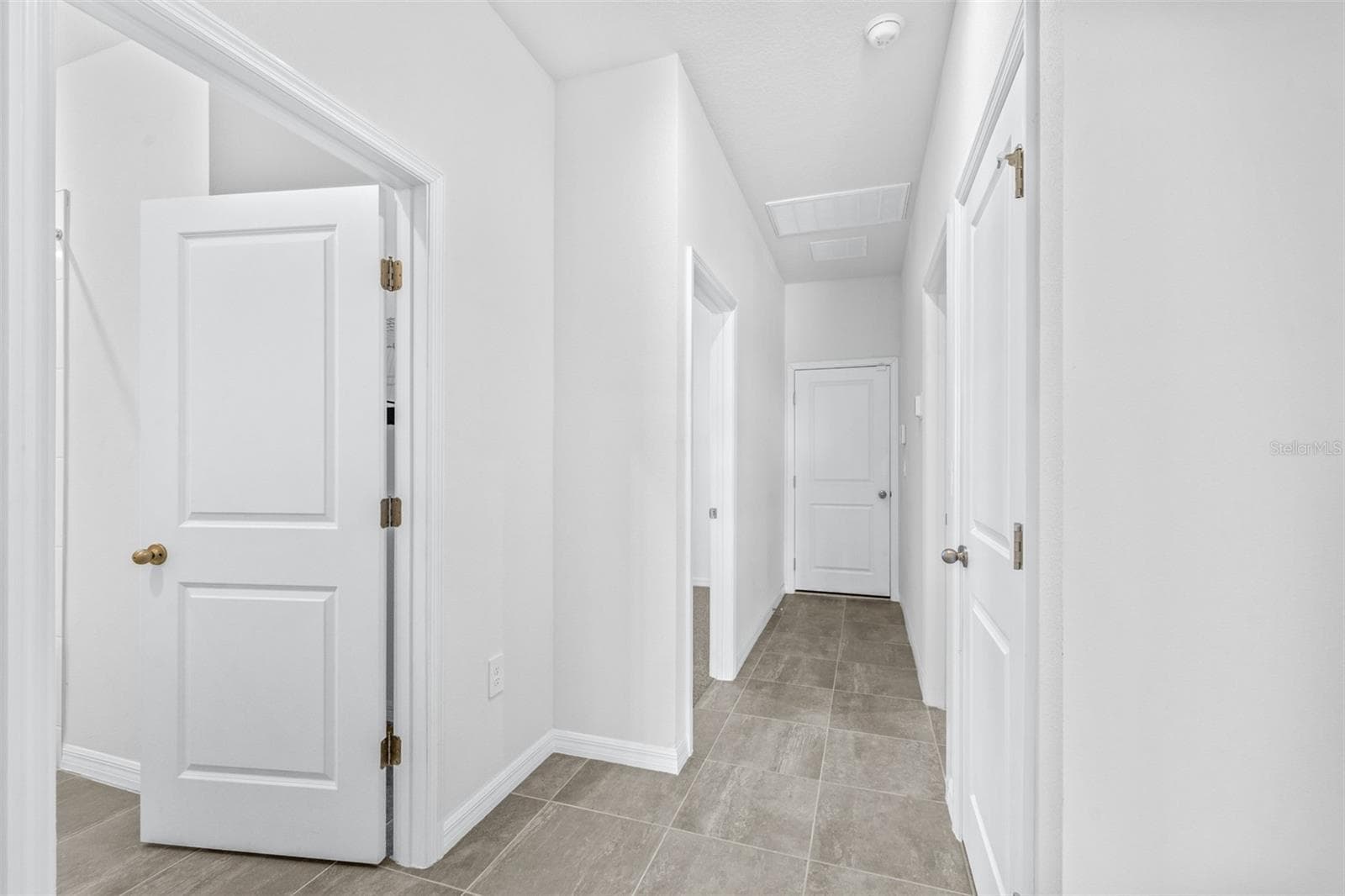 Hallway to garage - 2707 VIRGINIA PINE DR, BARTOW