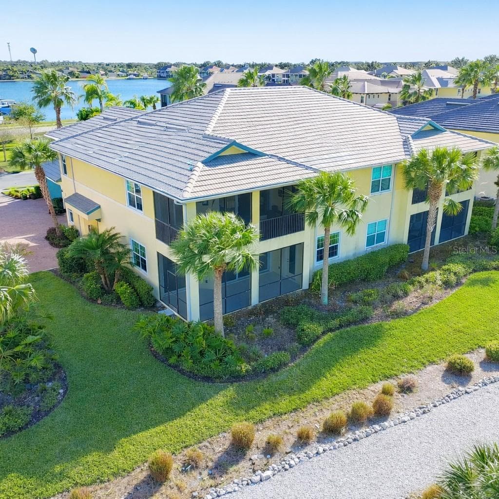 Exterior Rear corner. Unit downstairs near nature trail. - 1264 RIVERSCAPE ST #B, BRADENTON