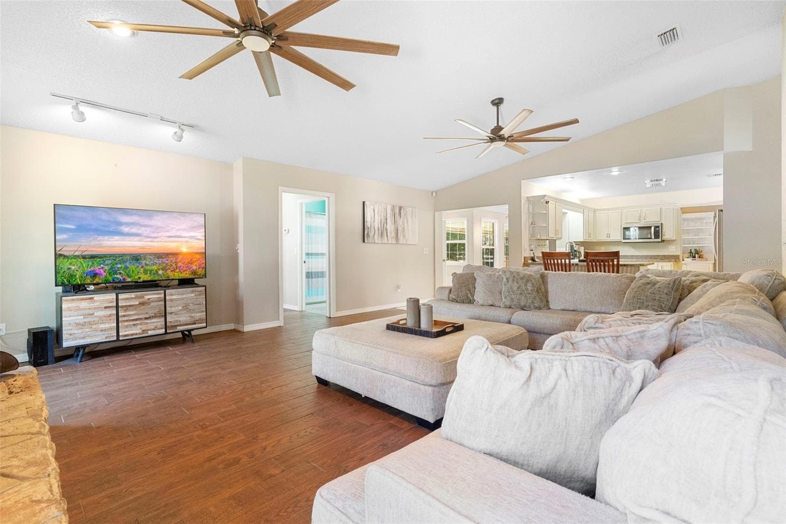 Living room with wood burning fire place - 3080 RAGIS RD, EDGEWATER