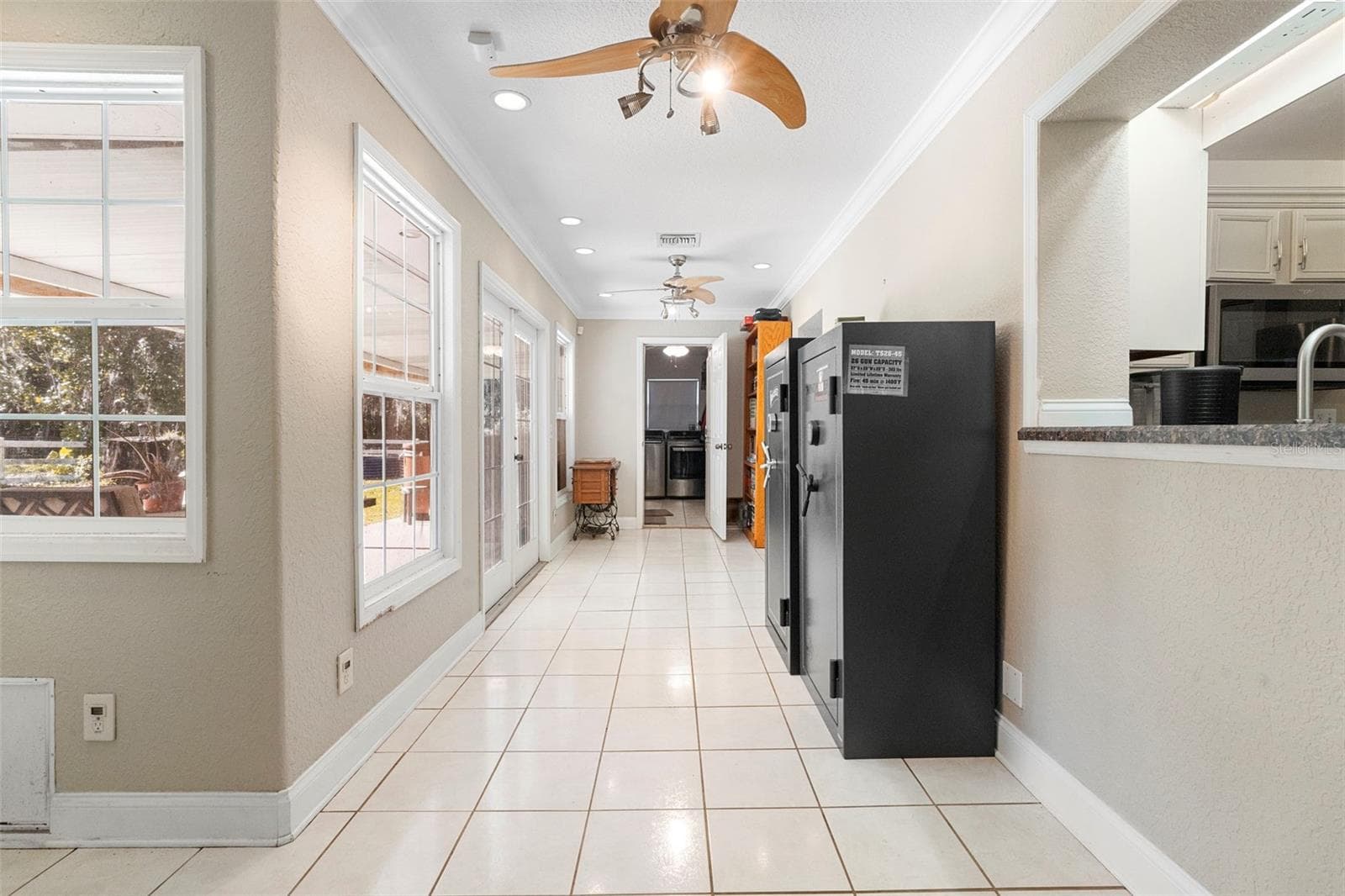 hallway to kitchen, bar and laundry - 3080 RAGIS RD, EDGEWATER