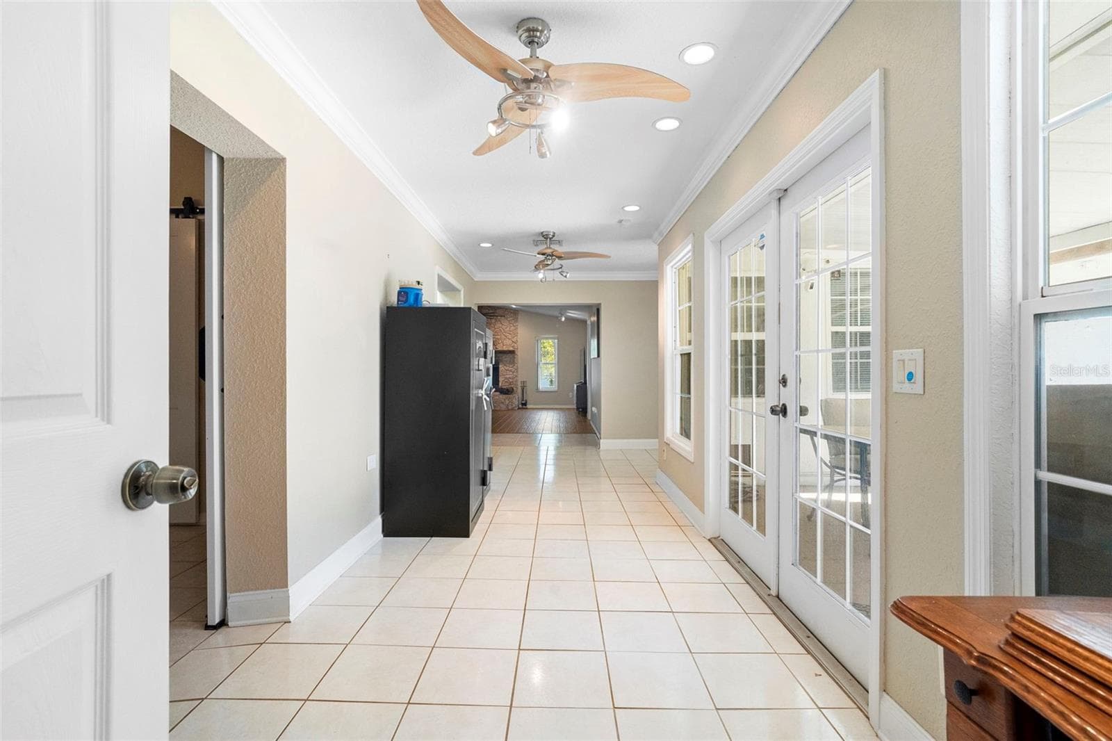 Hallway to kitchen , bar living room - 3080 RAGIS RD, EDGEWATER