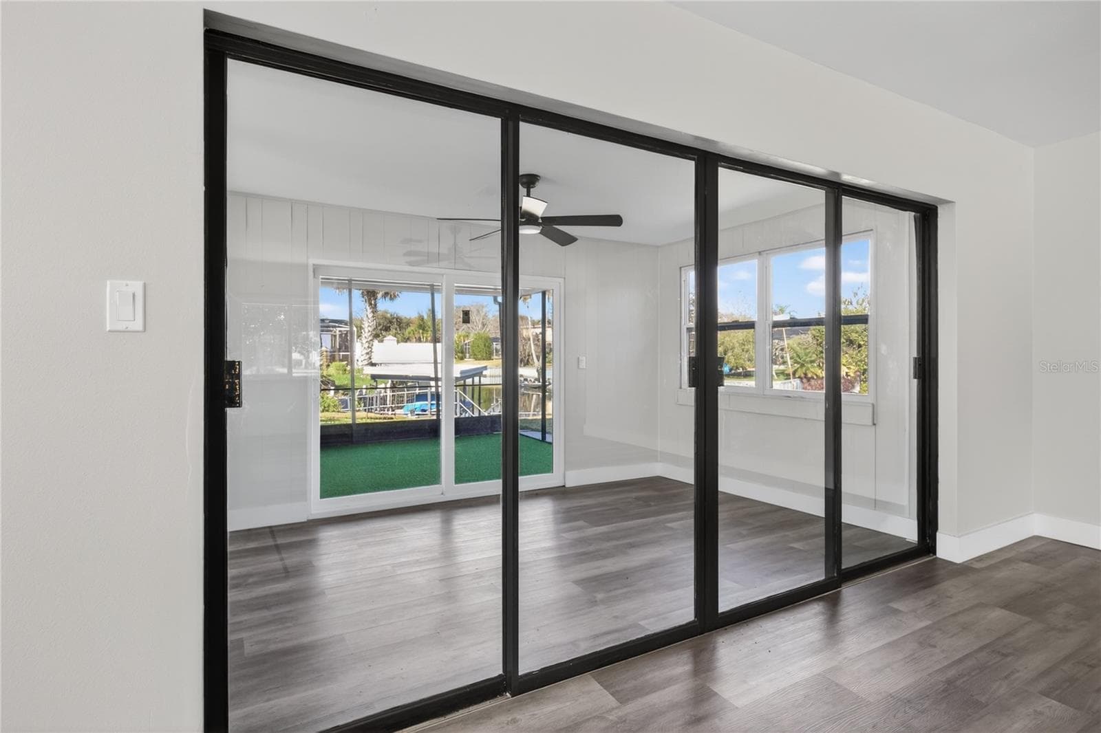 Living room looking into the sun/bonus room - 1503 CANAL CT, TAVARES