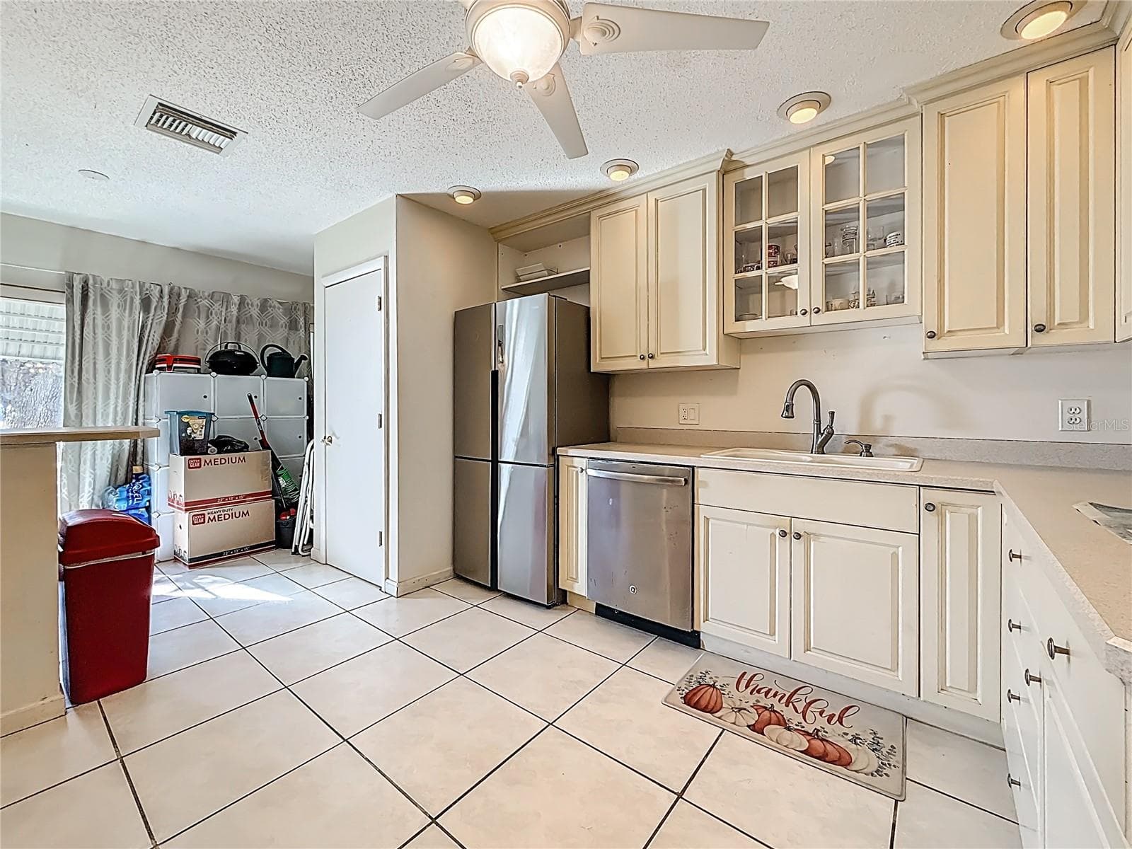 1020 85th Ave N no 119, Kitchen, laundry closet next to refrigerator - 1020 85TH AVE N #119, ST PETERSBURG