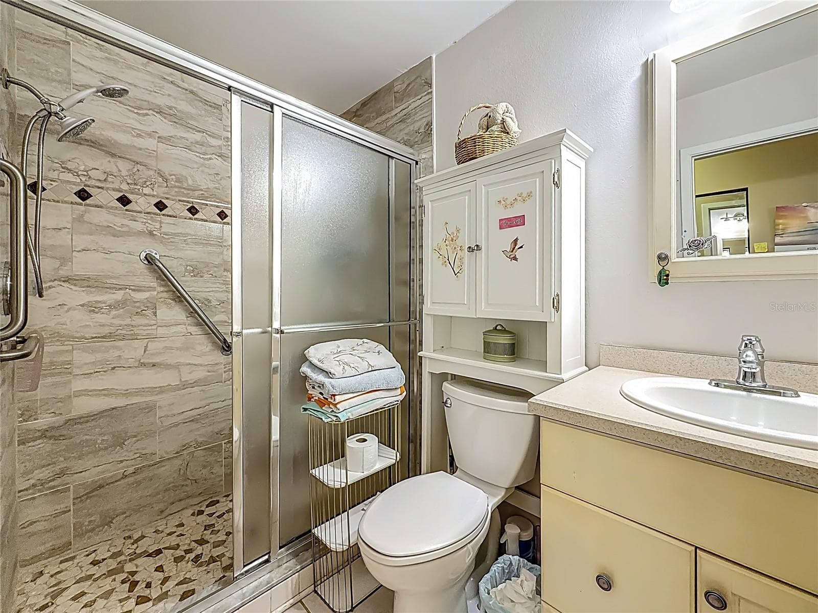 1020 85th Ave No no 119, primary bedroom ensuite bath, walk in shower with newer tile - 1020 85TH AVE N #119, ST PETERSBURG