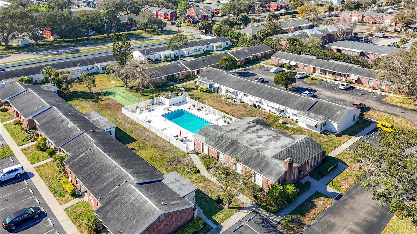 1020 85th Ave N no 119, Concord Village South community pool and clubhouse, view toward southwest - 1020 85TH AVE N #119, ST PETERSBURG