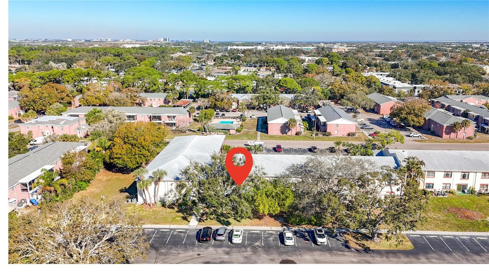1020 85th Ave N no 119, view toward north, visitor parking at back of unit - 1020 85TH AVE N #119, ST PETERSBURG