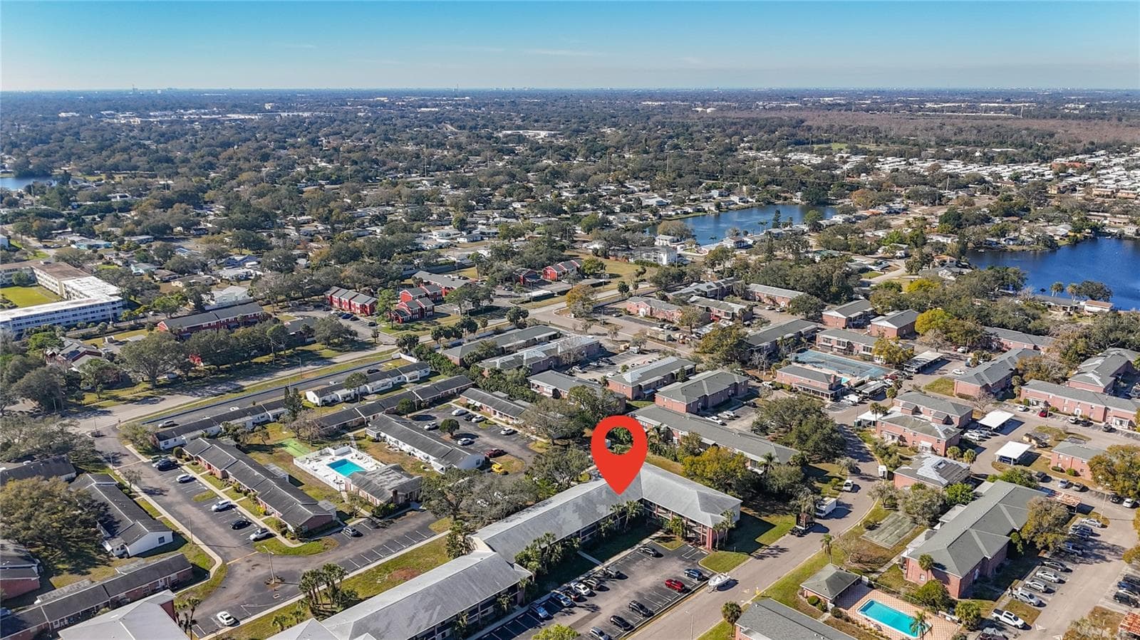 1020 85th Ave N no 119, View toward southwest, community pool and clubhouse to left - 1020 85TH AVE N #119, ST PETERSBURG