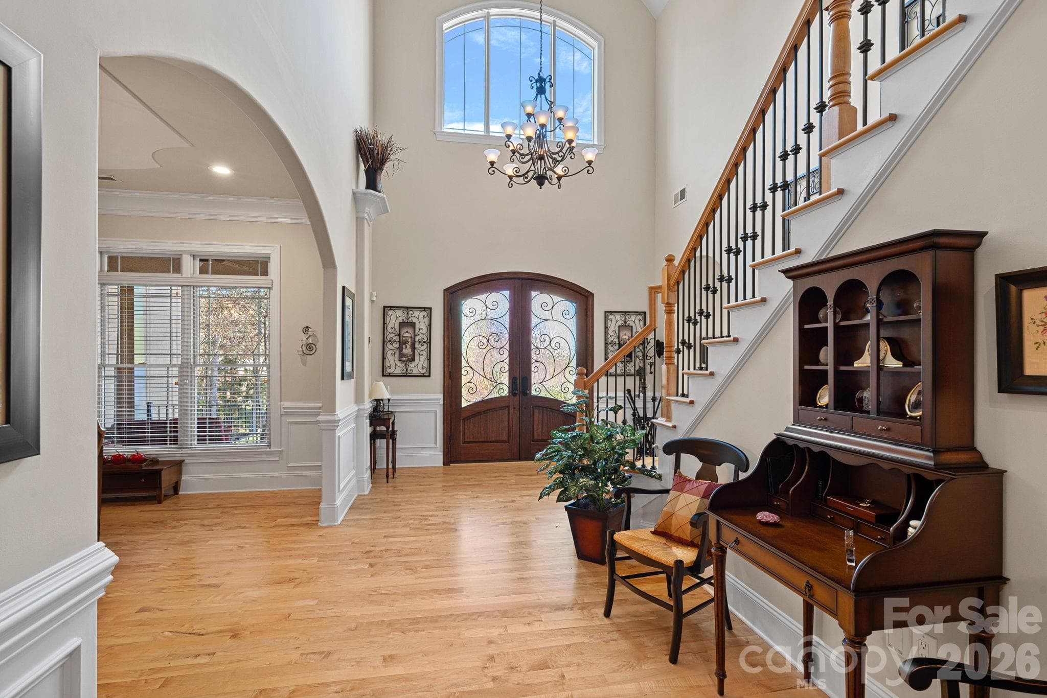Bright, open entry foyer with vaulted ceilings provides access to the den, living room, and dining room, and one of two staircases to the upper level. - Denver