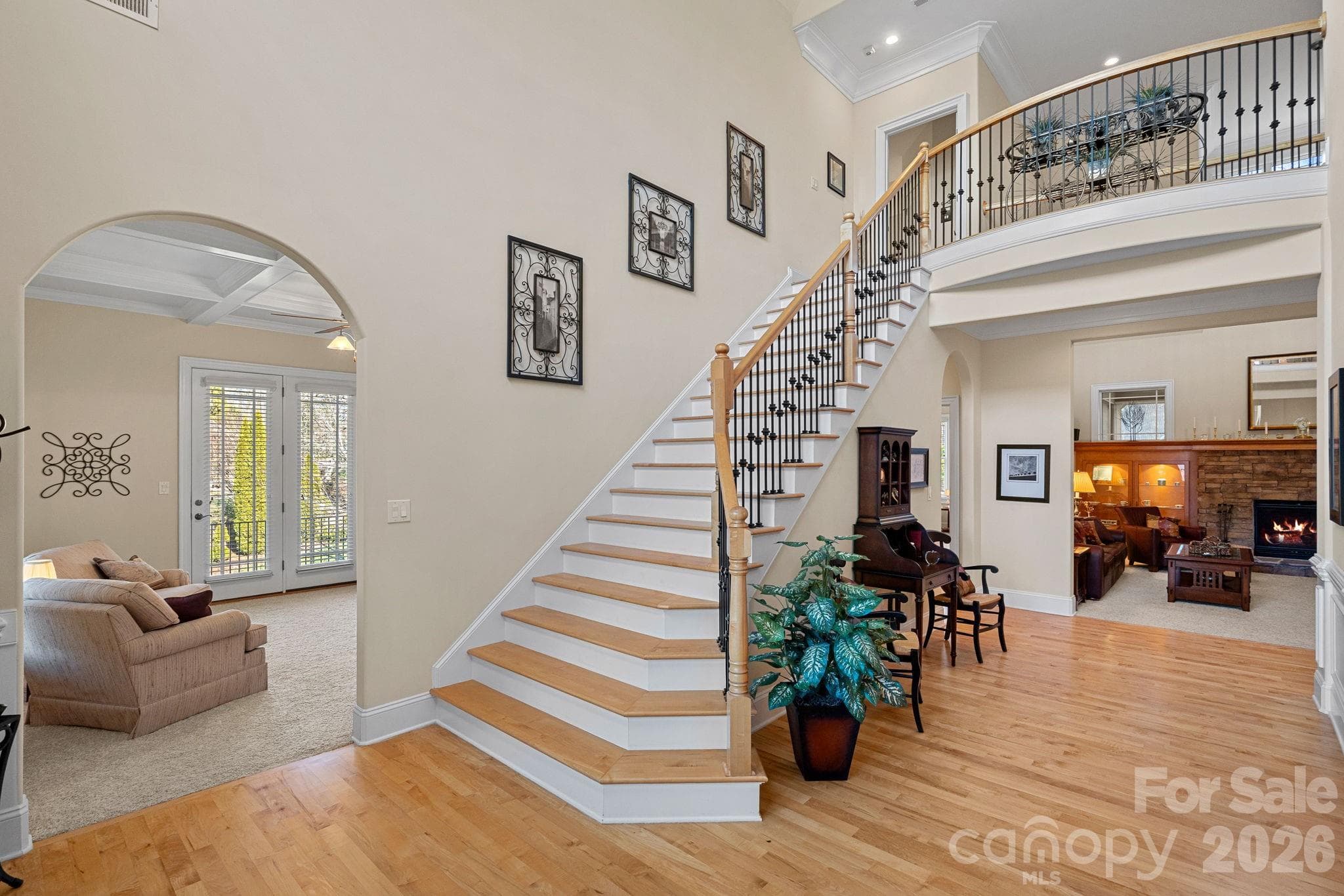 Bright, open entry foyer with vaulted ceilings provides access to the den, living room, and dining room, and one of two staircases to the upper level. - Denver