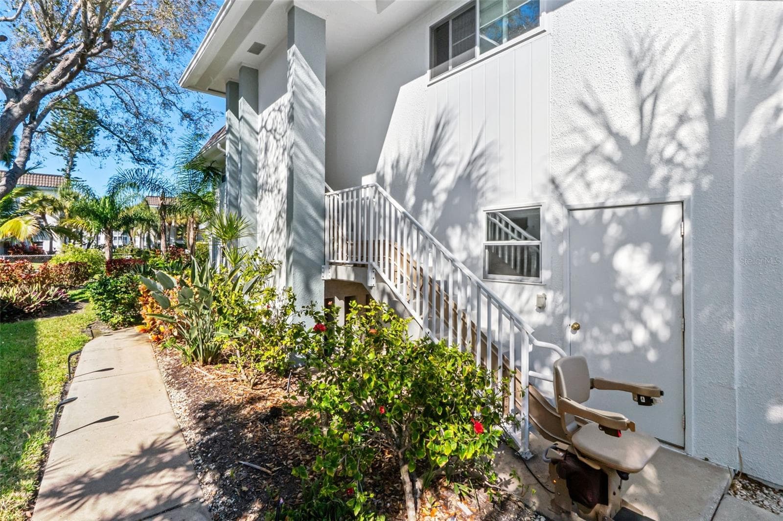 Entry with stair lift. - 531 SUTTON PL, LONGBOAT KEY