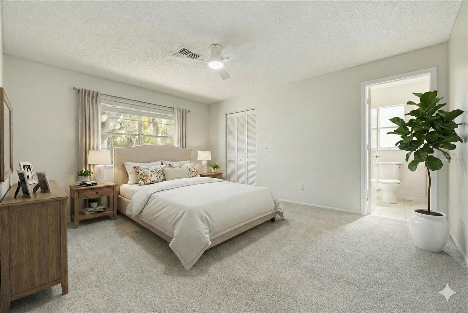 Virtually Staged Primary Bedroom en suite bathroom - 3569 OAK LAKE DR, PALM HARBOR