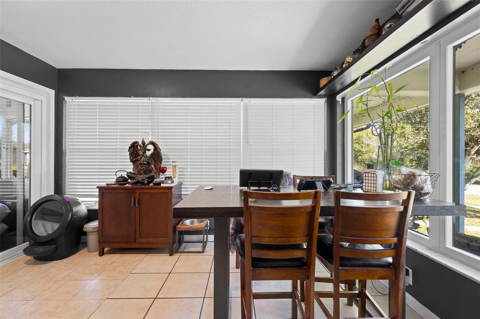 View of dining area with new windows. - 1552 ZINNIA DR, DELTONA