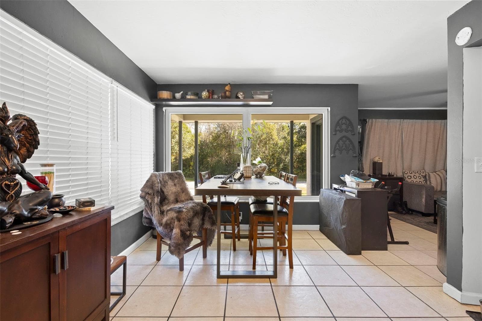 View of dining area and entrance toward living room. - 1552 ZINNIA DR, DELTONA