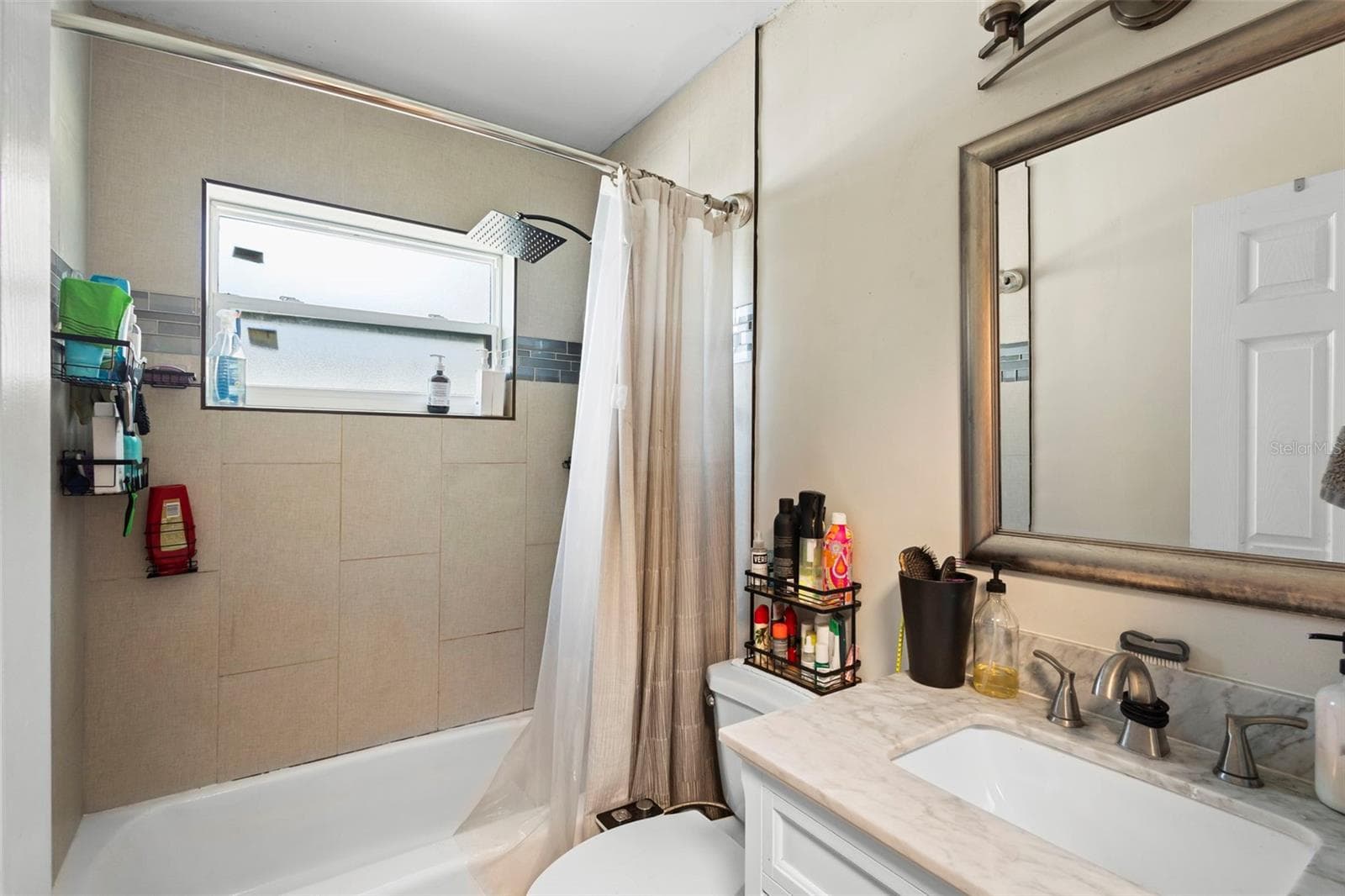 View of bathroom with tub and shower. - 1552 ZINNIA DR, DELTONA