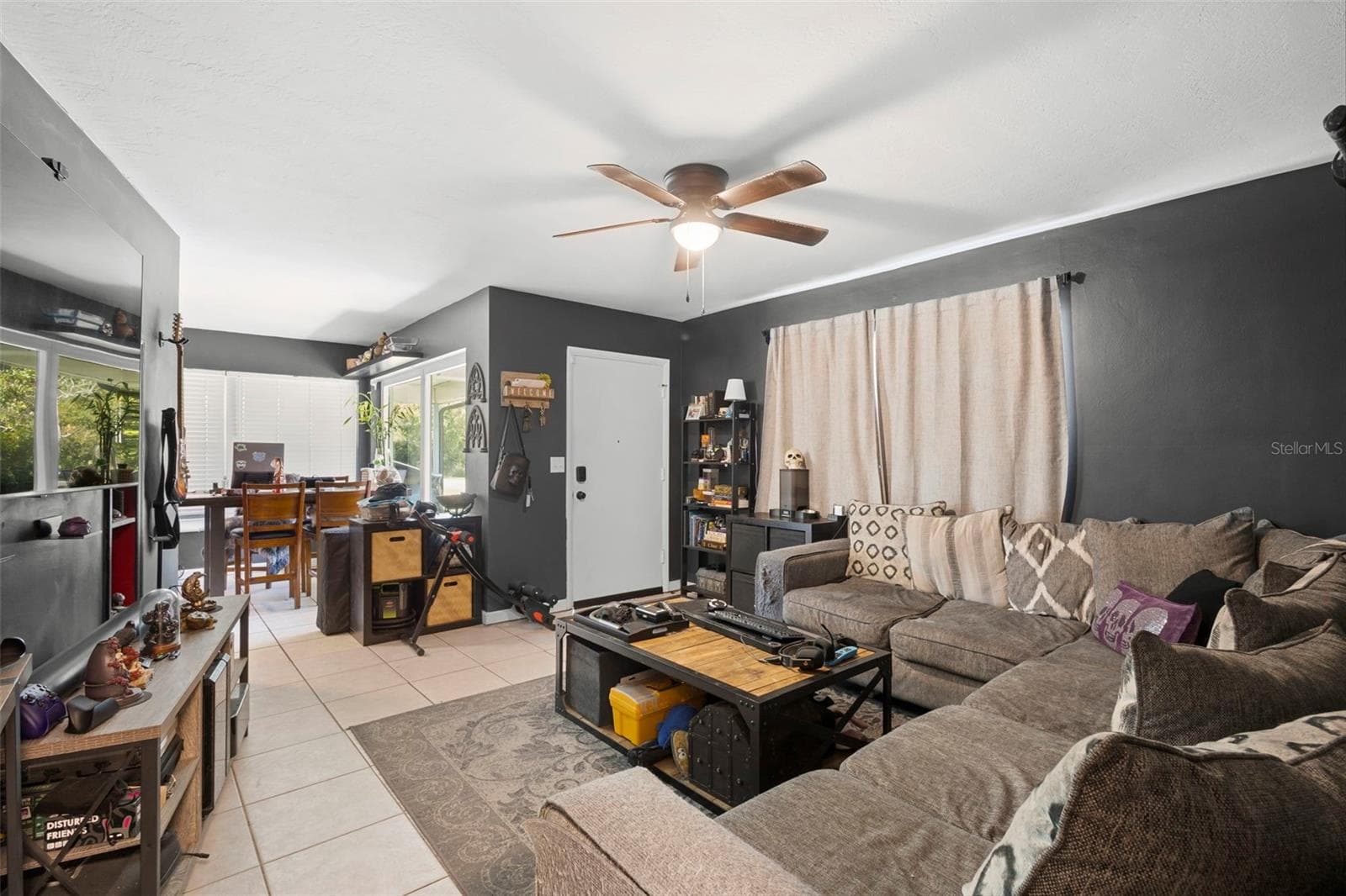 View of living room from breezeway. - 1552 ZINNIA DR, DELTONA