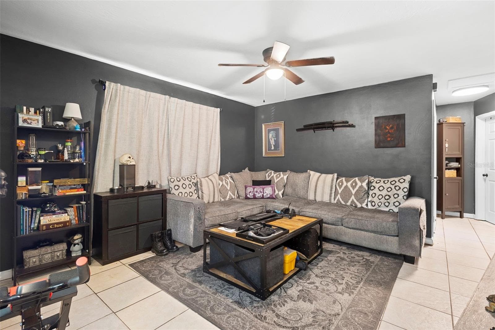 View of living room tiled flooring. - 1552 ZINNIA DR, DELTONA