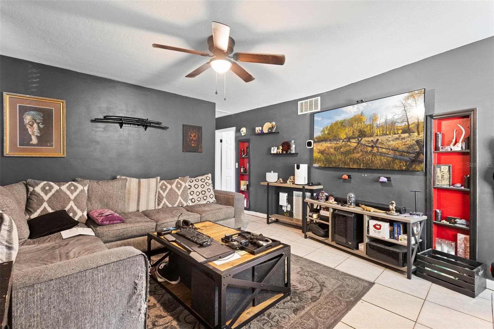 View of living room from entrance. - 1552 ZINNIA DR, DELTONA