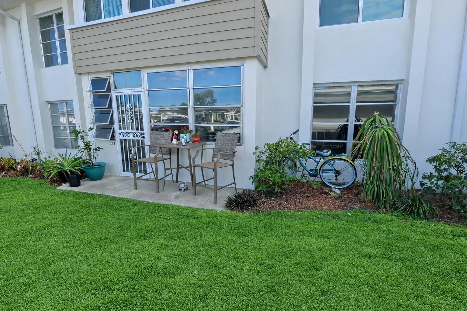Front Entry Parking lot entrance - 21300 BRINSON AVE #111, PORT CHARLOTTE