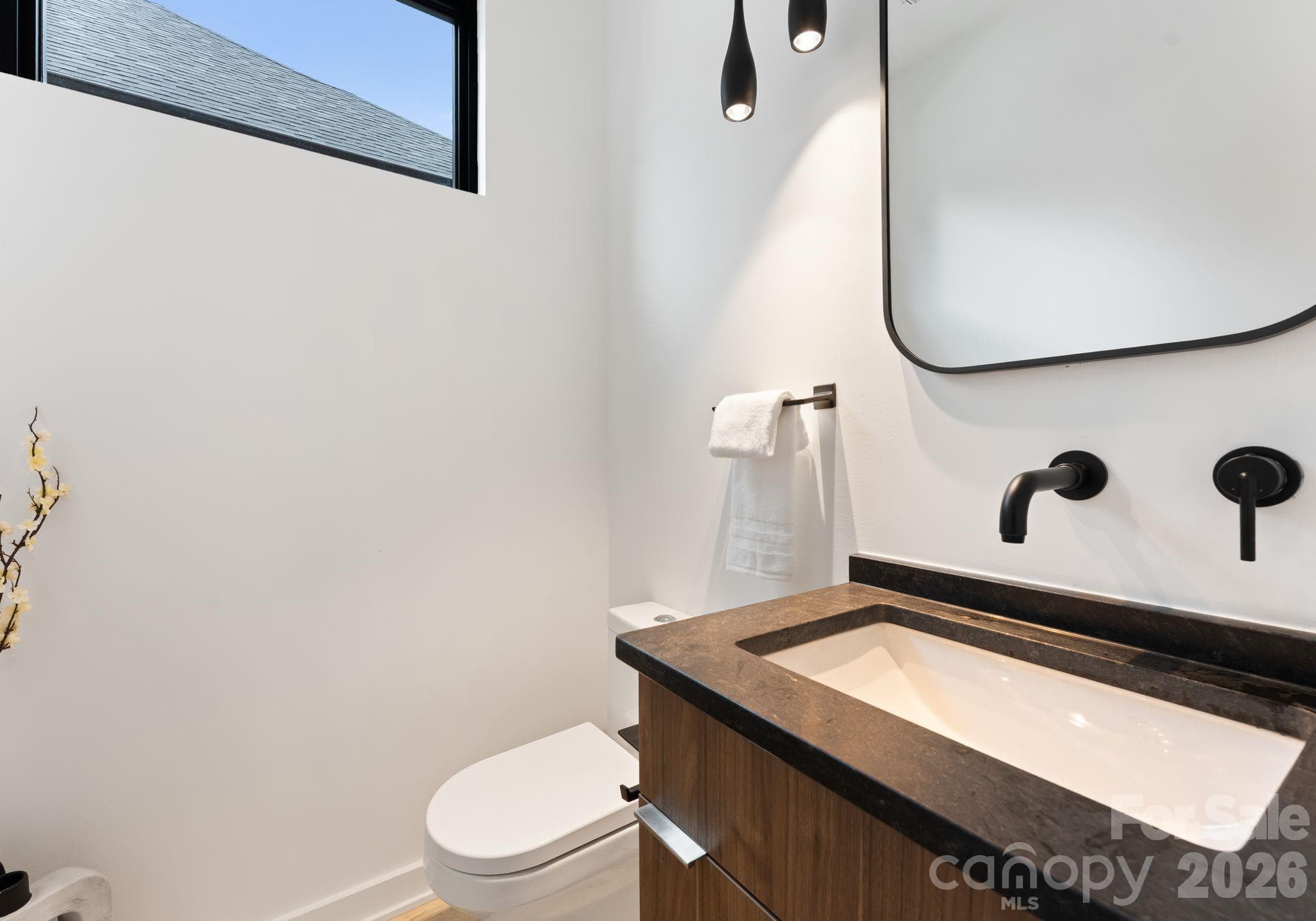 Main level half bathroom. - Charlotte