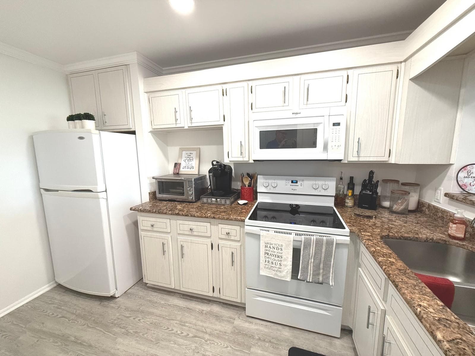 Kitchen with Granite - 100 BLUFF VIEW DR #317A, BELLEAIR BLUFFS