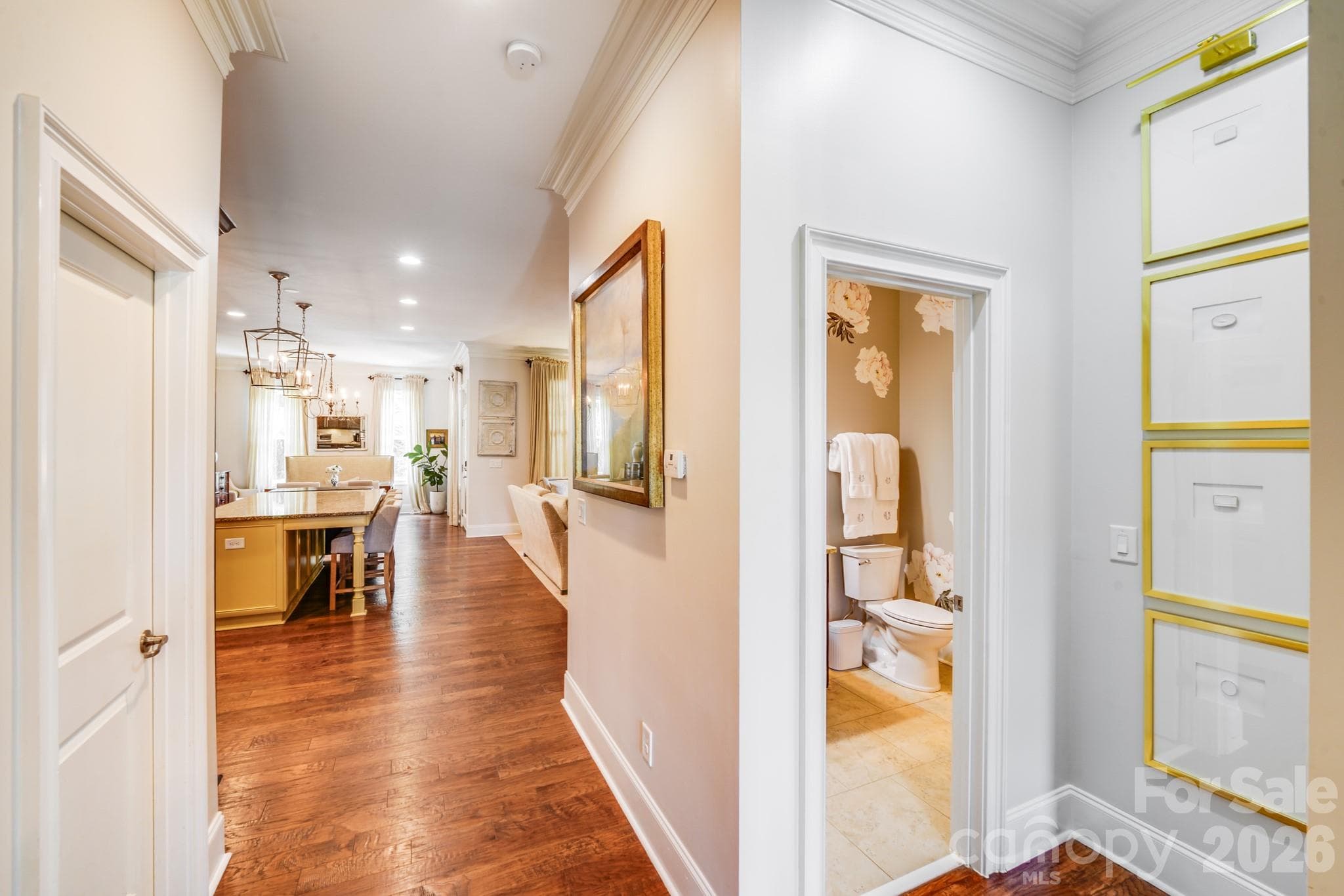 Rich hardwood flooring flows seamlessly into the kitchen, dining, and living areas, creating a warm, connected feel - 2702 Arsdale Road, Waxhaw