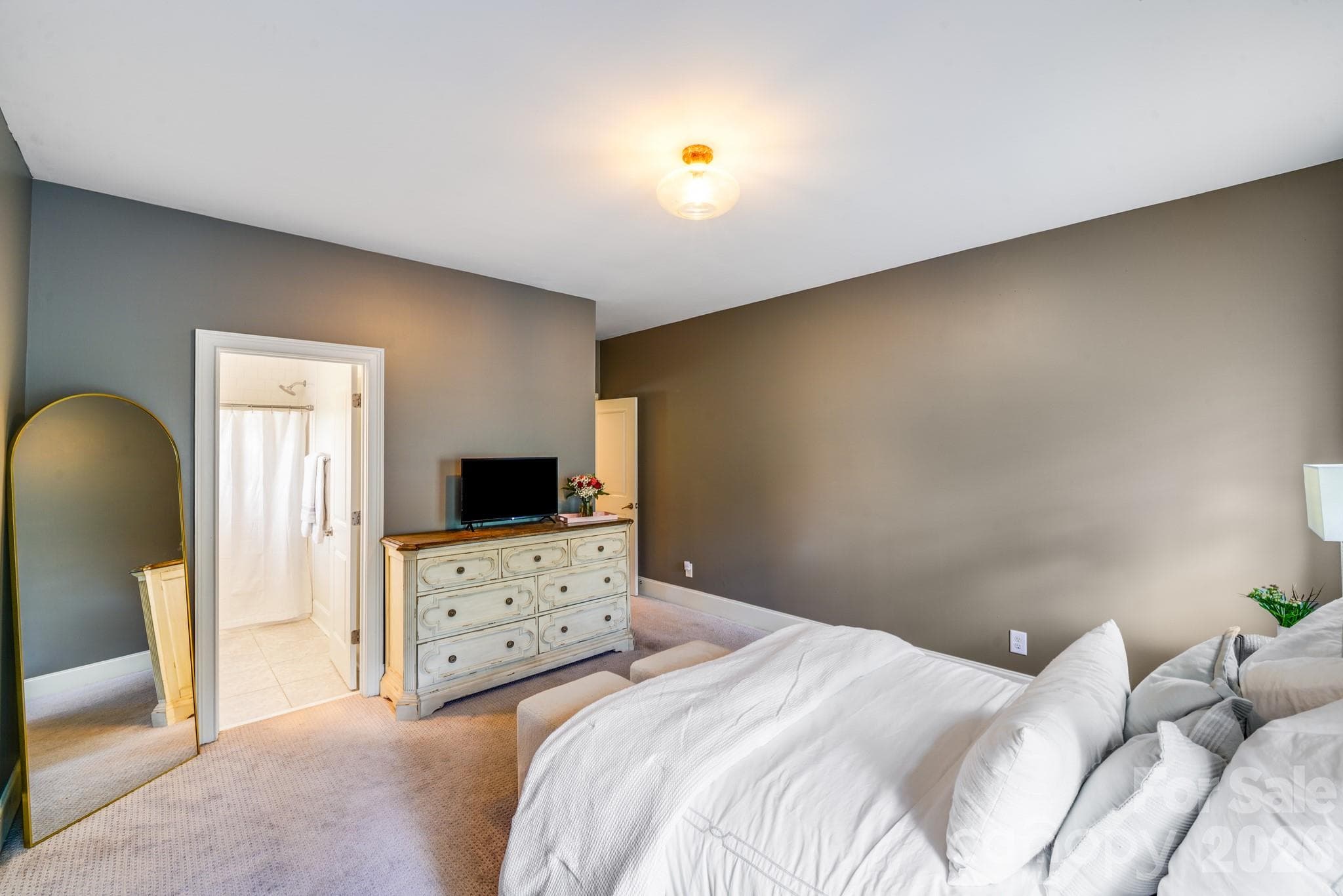 Spacious secondary bedroom features direct access to a private ensuite bath - 2702 Arsdale Road, Waxhaw