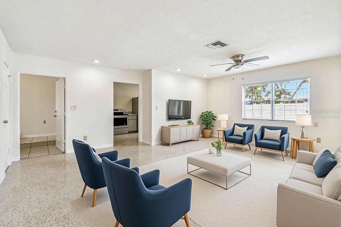 East Residence - Living and Florida Room Virtually Staged - 1101 81ST AVE N, ST PETERSBURG