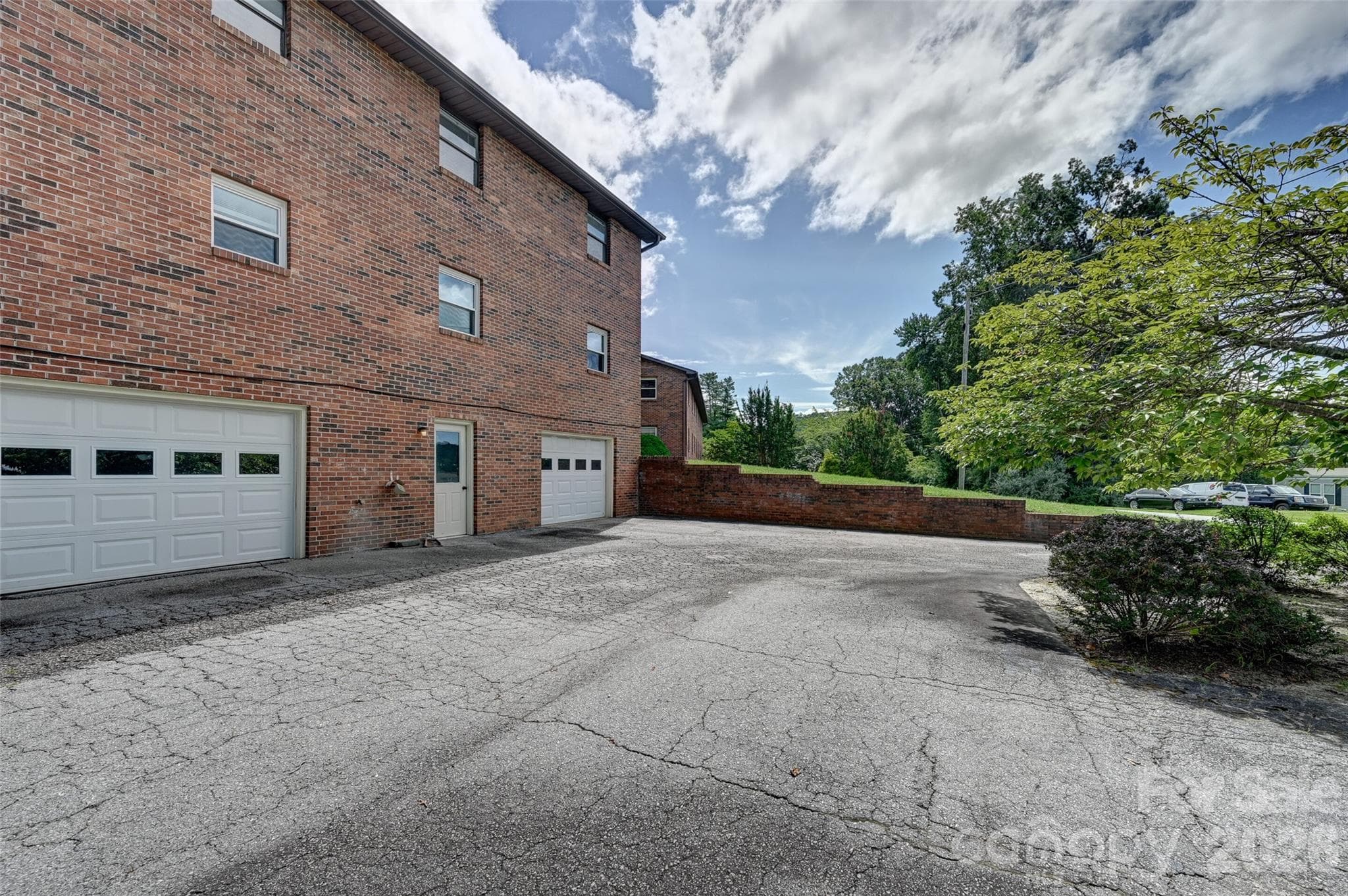 This unit has a garage/basement on the far right as you face the building from the rear - Hendersonville