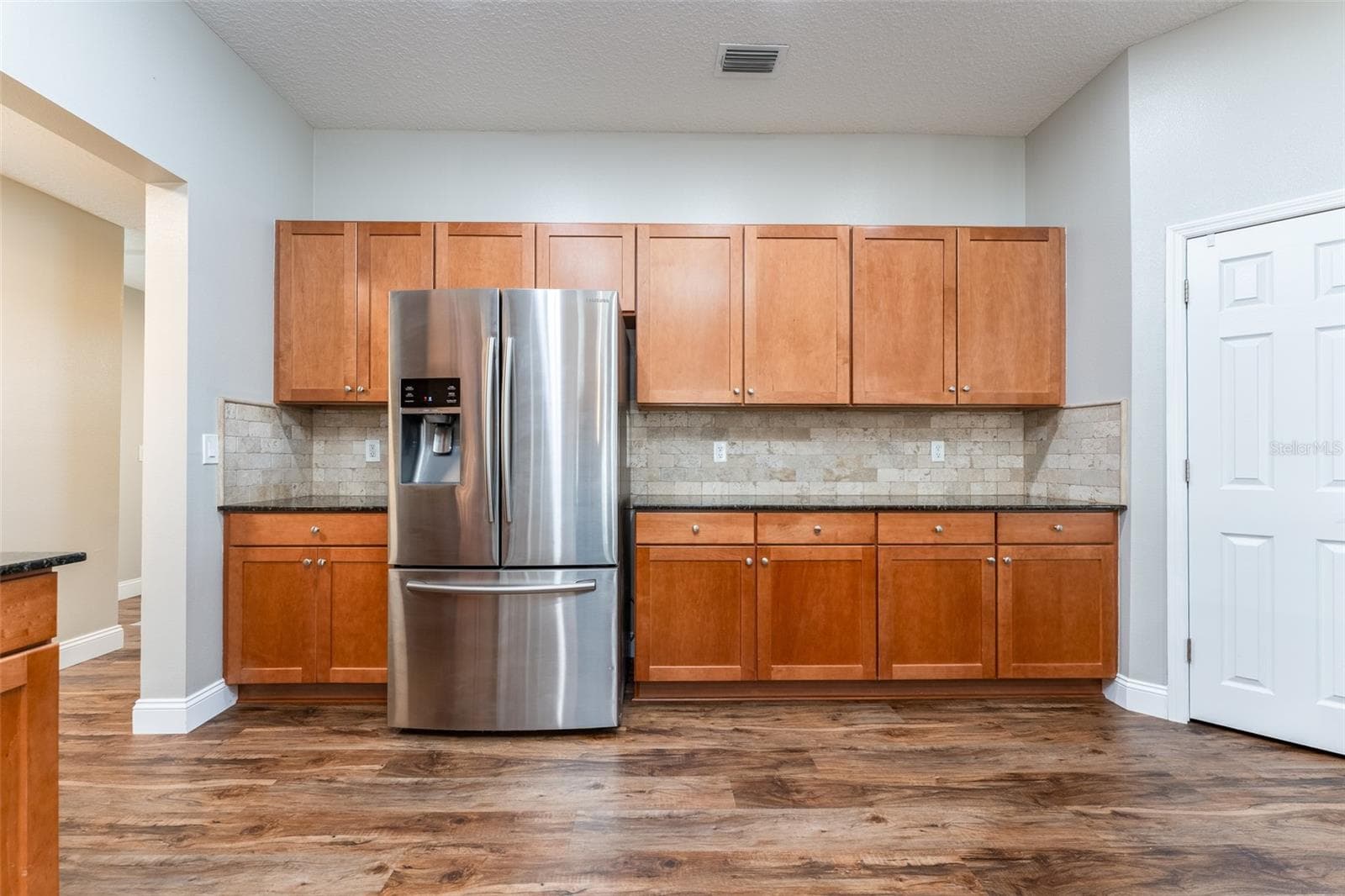 Chef will be happy with all the solid wood cabinet space. - 5431 SANDY SHELL DR, APOLLO BEACH