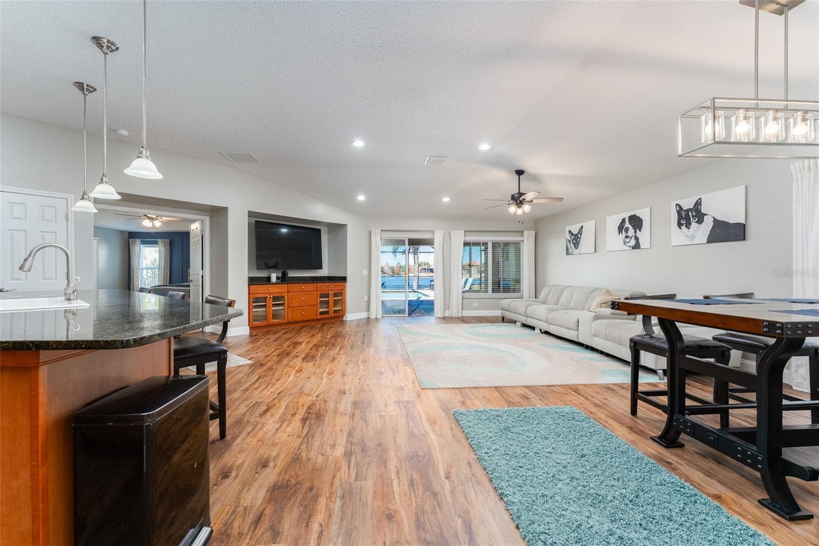 Kitchen, dining, family room with luxury plank vinyl flooring - 5431 SANDY SHELL DR, APOLLO BEACH