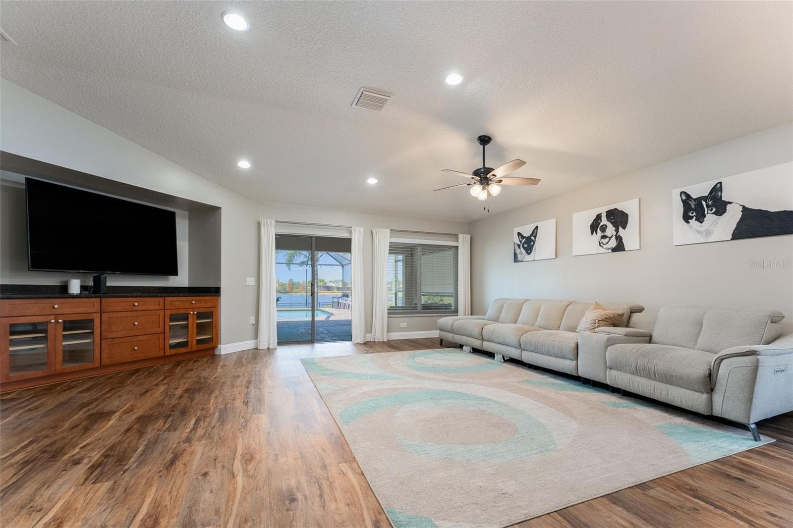 Family room with built in entertainment center with storage - 5431 SANDY SHELL DR, APOLLO BEACH